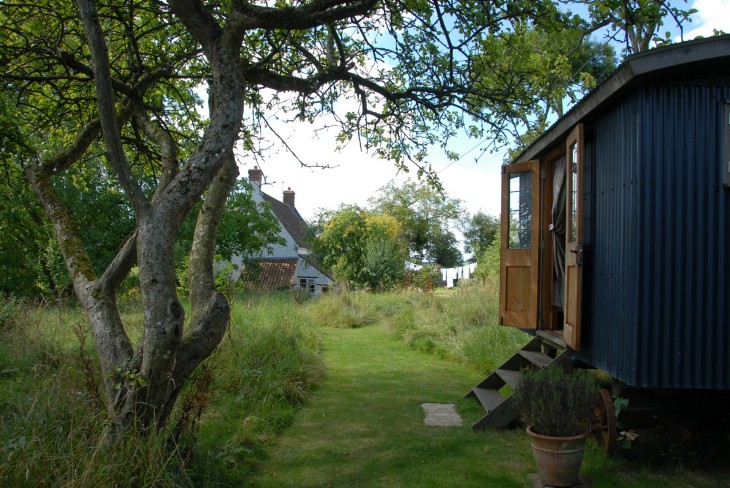 Shepherd's Hut B&B  with cottage where Steinbeck stayed in the background.JPG